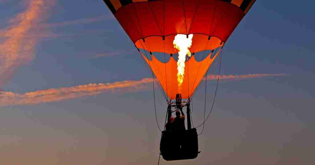 a hot air balloon with flames coming out of it